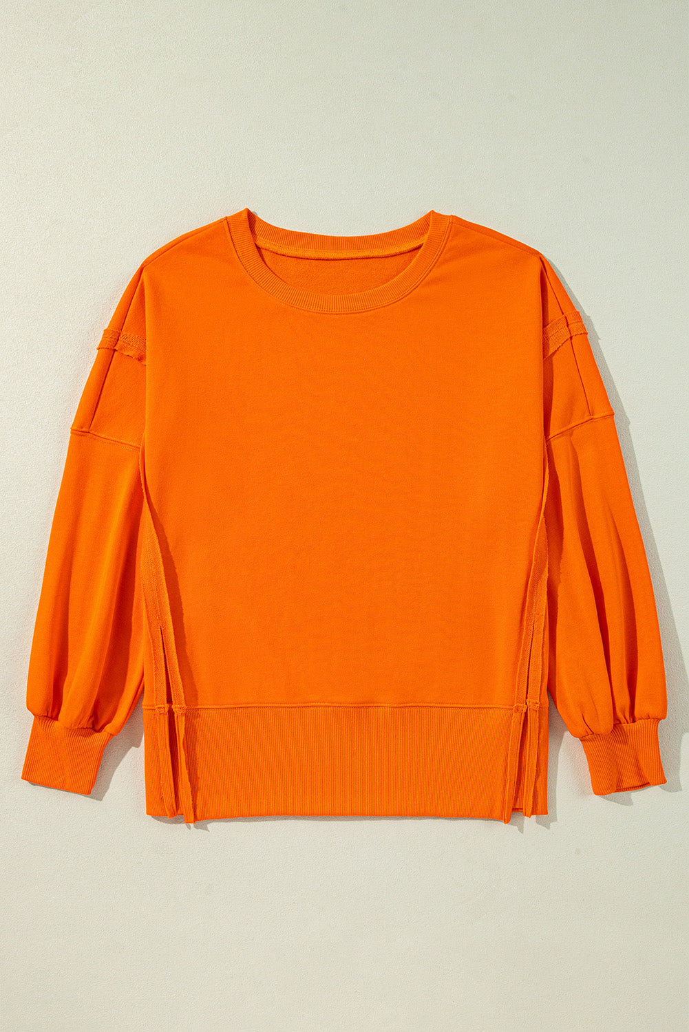 Carrot Exposed Seam Drop Shoulder Side Slit Sweatshirt