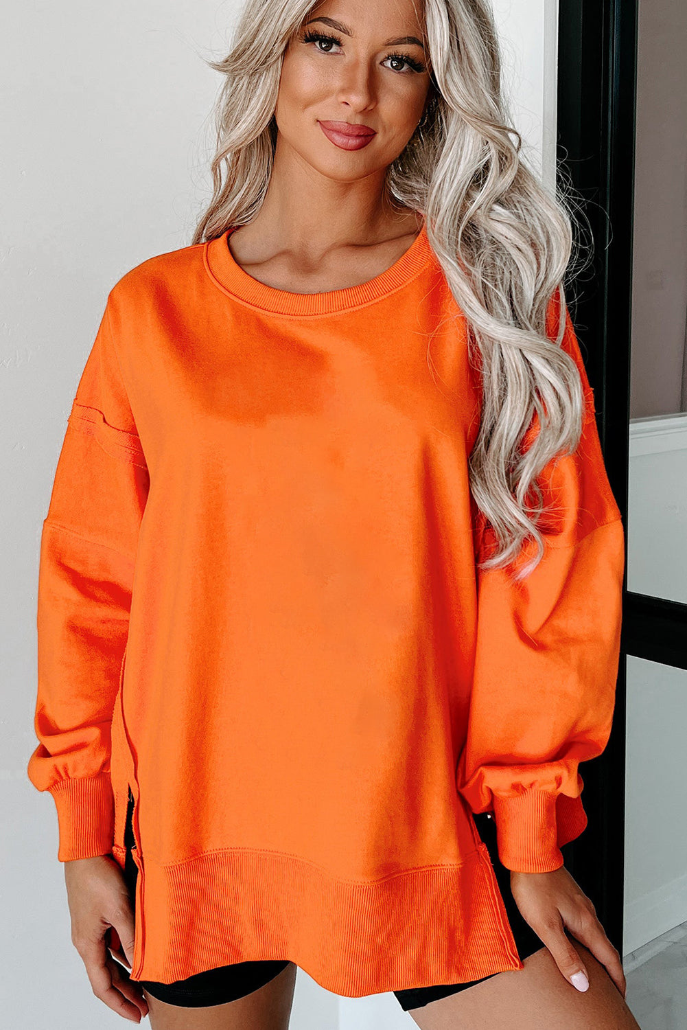 Carrot Exposed Seam Drop Shoulder Side Slit Sweatshirt