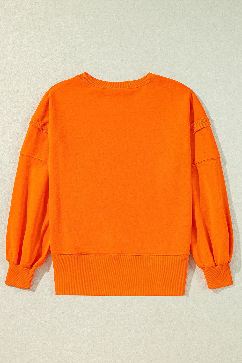 Carrot Exposed Seam Drop Shoulder Side Slit Sweatshirt